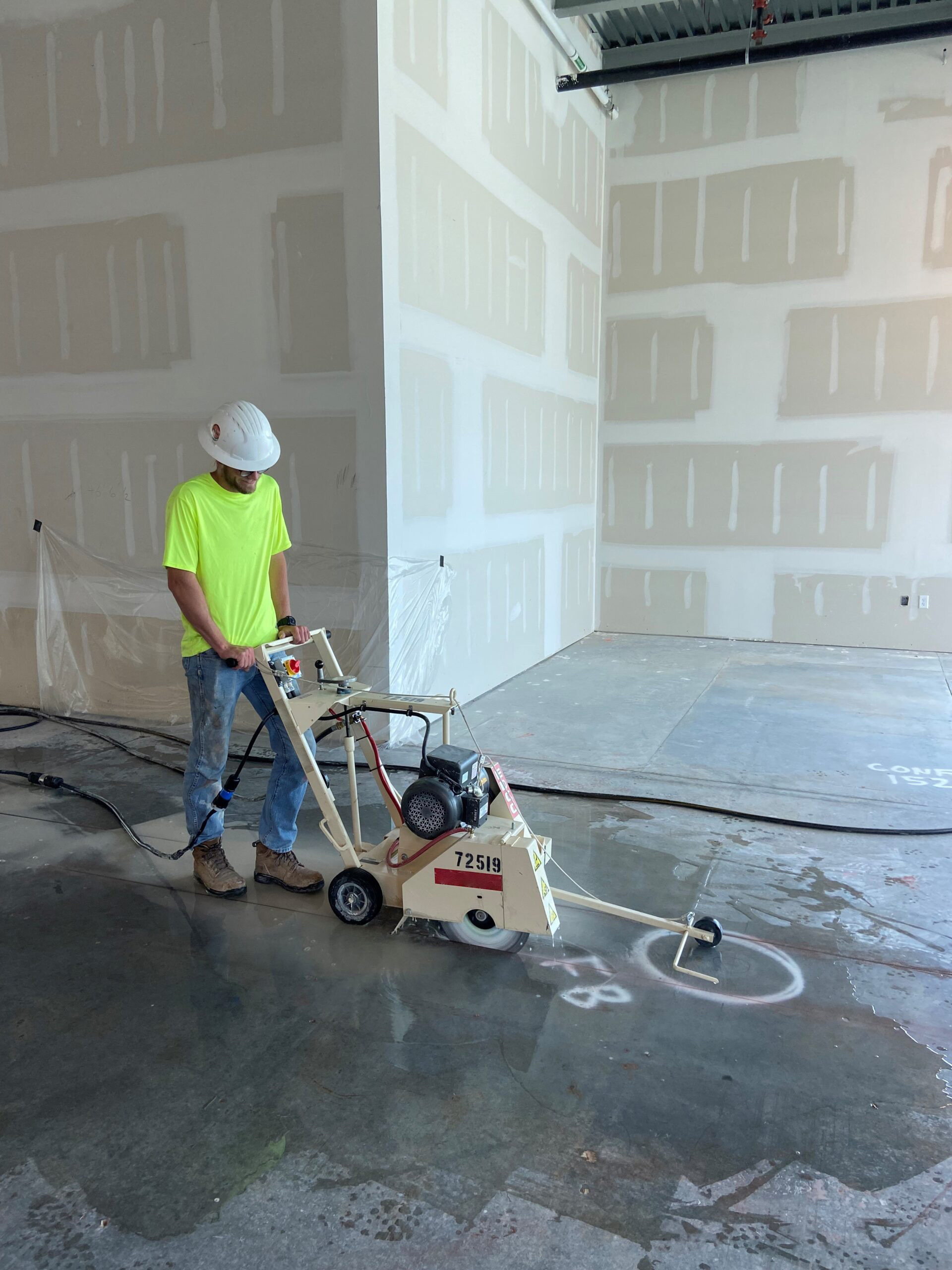 man with concrete cutting machine